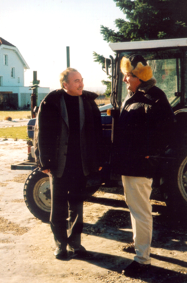 Willi Opitz (on the left) explains how his CD of grapes fermenting paid for the tractor behind him